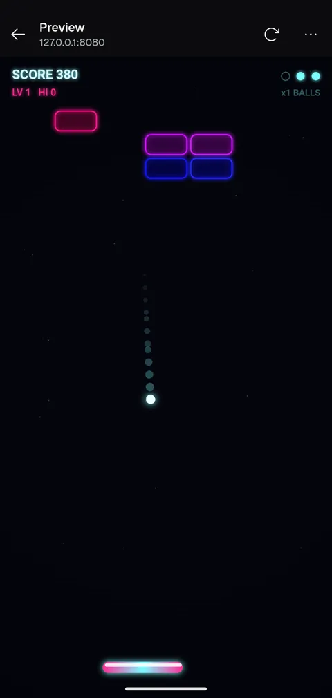 The in-app preview showing the neon brick-breaker running from a local dev server.