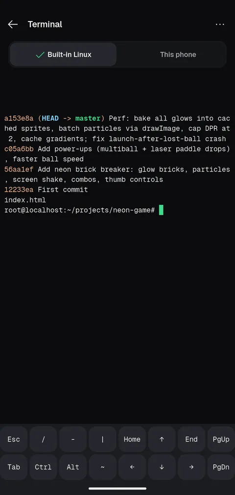 The built-in Linux terminal in the neon game project showing the git log with the agent's commits.